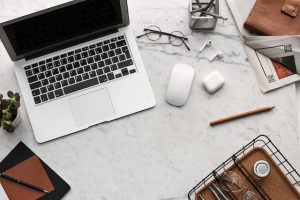 image of a laptop in the office table in Petrie Terrace